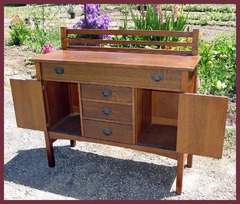 Shown with the two cabinet doors open. Both doors have their original functioning locks and a vintage old key is included. 